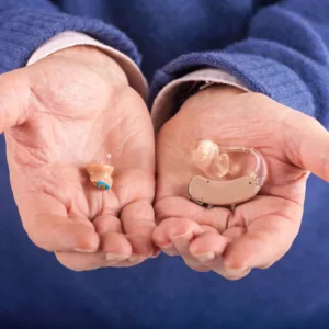 Hearing Aids in Hands Needing Repair